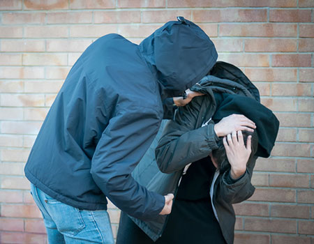 An image of a boy being threatened with violence by another boy