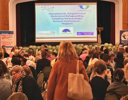 An image of lots of people in a conference room